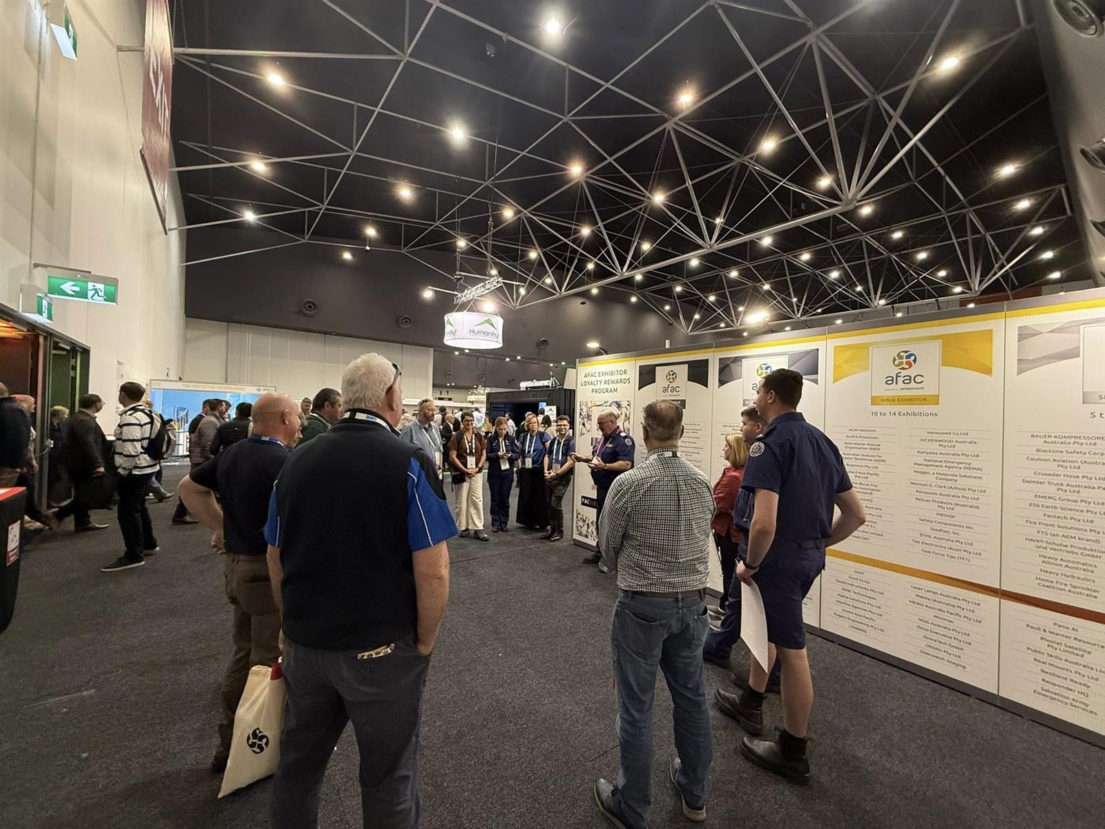 CFA delegates on tour in the Exhibition Centre at AFAC